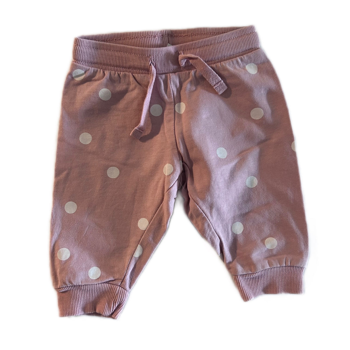 H&M Age 000 trousers / jogger pants in dusty pink with white polka dots â€” gently loved condition.