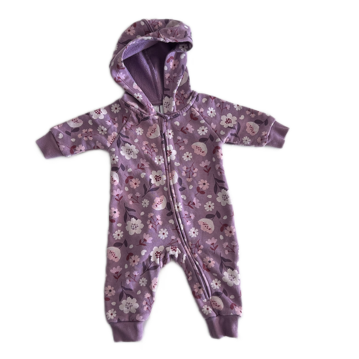 Anko Age 000 hooded zip-up baby onesie with long sleeves and cuffed ankles in purple with floral print with flowers and leaves in white, pink and dark burgundy â€” like new condition.