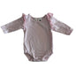 Dymples Age 000 long sleeve bodysuit in pink with lace frill shoulder detail â€” gently loved condition.