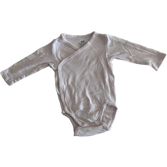 H&M Age 000 long sleeve wrap bodysuit in light pink with plain â€” gently loved condition.
