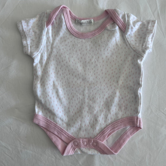 Bonjour BÃ©bÃ© Age 000 short sleeve snap-crotch bodysuit in white and pink with pink polka dots with pink trim â€” gently loved condition.