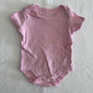 Rock-a-Bye Baby Boutique Age 000 short sleeve bodysuit in pink with polka dot â€” gently loved condition.
