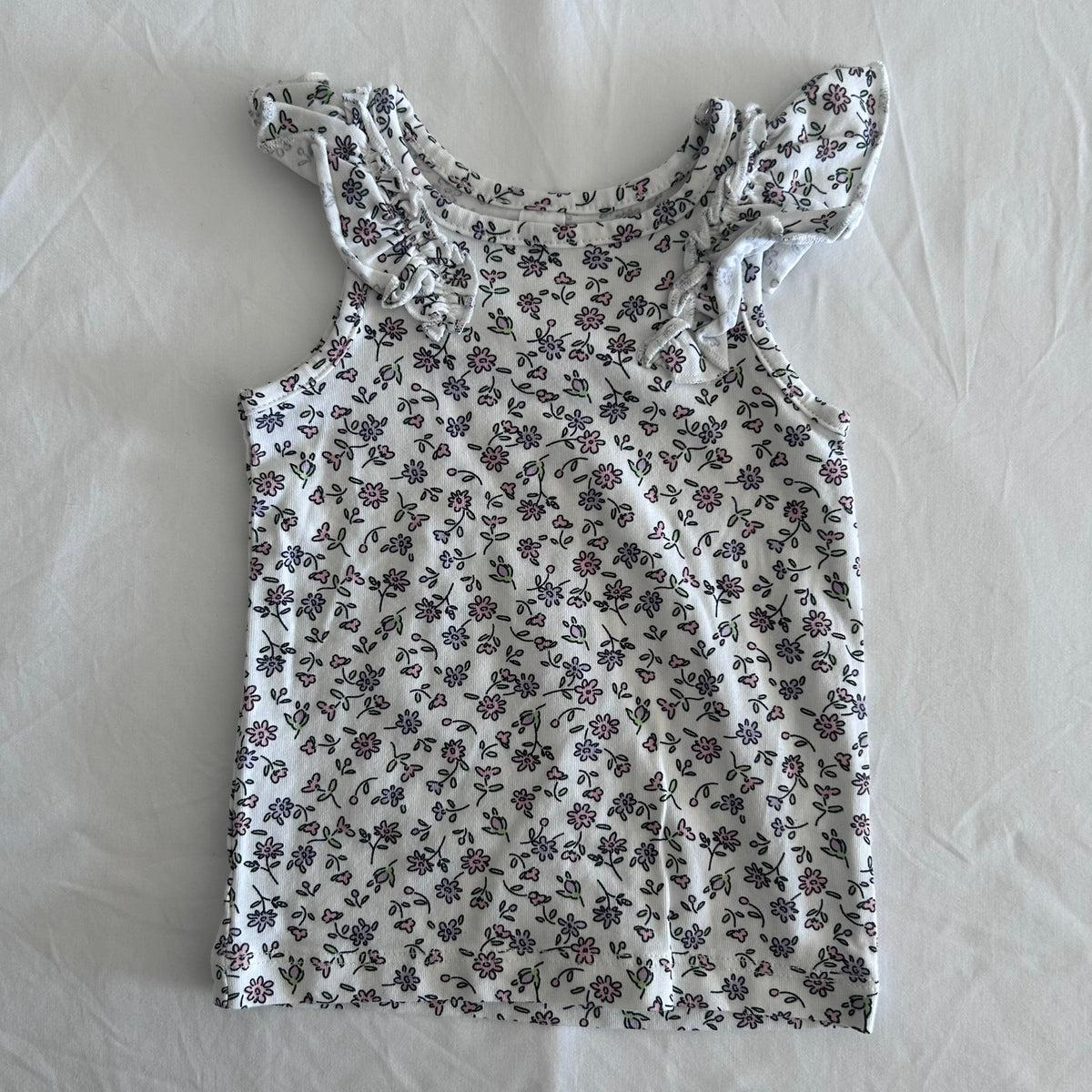 Dymples Age 000 sleeveless flutter sleeve top / singlet / vest in white, pink, purple, green with ditsy floral print â€” gently loved condition.