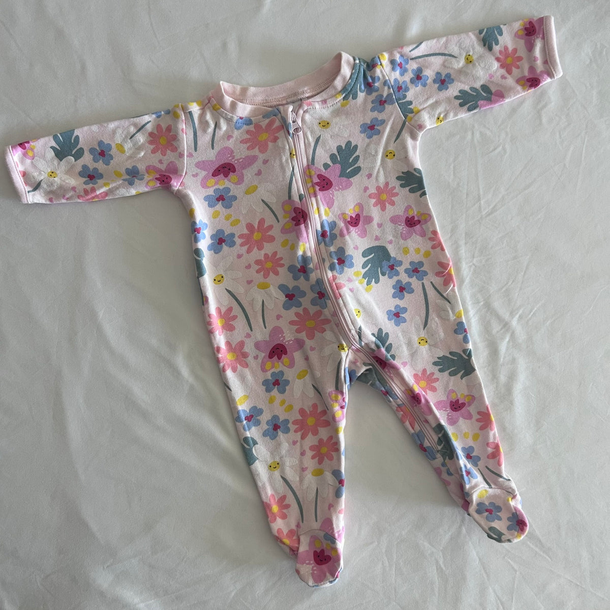 Anko Age 000 long sleeved onesie in pink, white, blue, green, yellow with floral and butterfly print â€” gently loved condition.