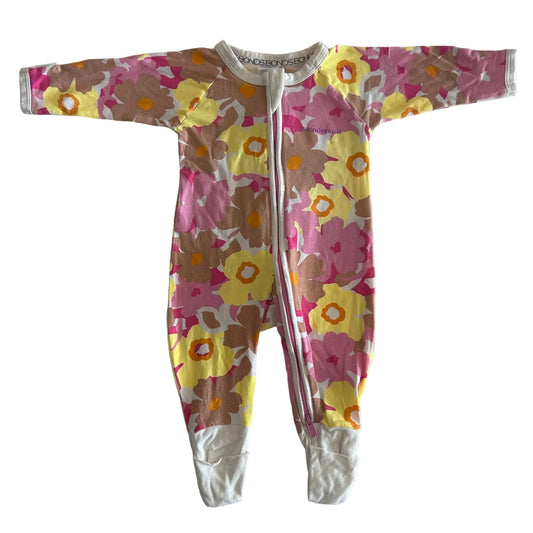 Bonds Age 000 long sleeve zip onesie wondersuit in pink, yellow, orange, brown, white with large floral print â€” gently loved condition.
