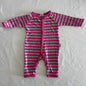 Bonds Age 000 long sleeve snap button onesie in pink, grey with horizontal stripes â€” gently loved condition.
