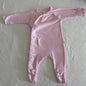 Bonds Age 000 long sleeve onesie in pink with allover white cursive script text print with small hearts â€” gently loved condition.