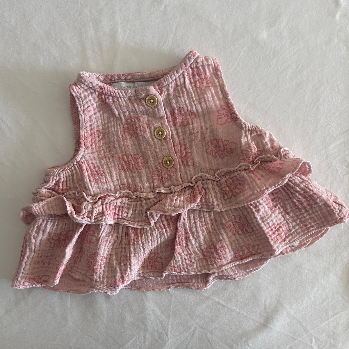 Catherine Malandrino Baby Age 000 dress in pink with floral print, tiered ruffle hem, button front â€” gently loved condition.