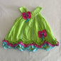Dolish Age 000 dress in lime green, hot pink, turquoise with swiss dot fabric, polka dot ribbon flower appliquÃ©s, tiered ruffle hem, ribbon trim â€” gently loved condition.