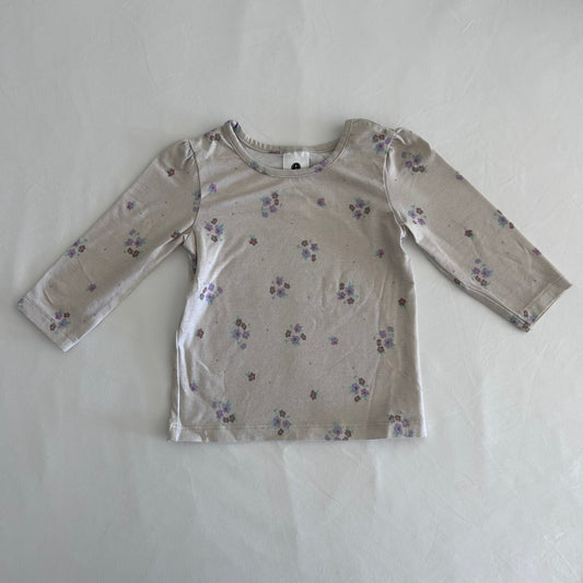 Dymples Age 00 long sleeved t-shirt in beige, purple, blue, brown with scattered small floral print â€” gently loved condition.