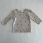 Dymples Age 00 long sleeved t-shirt in beige, purple, blue, brown with scattered small floral print â€” gently loved condition.