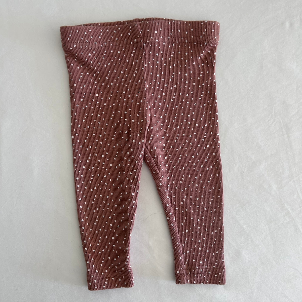 Miann & Co Age 00 leggings in brown with white speckle/polka dot print, ribbed fabric â€” gently loved condition.