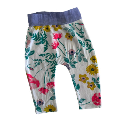 Bonds Age 00 trousers / leggings in white, lavender, pink, yellow, green with floral print with mixed wildflowers and foliage; lavender mesh/lace elastic waistband â€” gently loved condition.