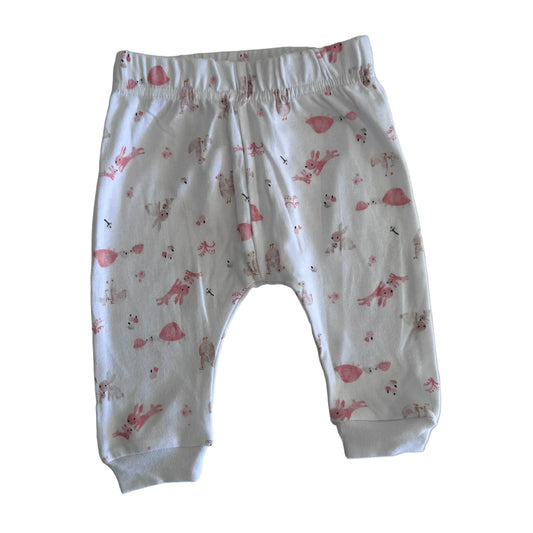 Sunrise Traders Ltd Age 00 trousers / jogger pants in white with pink with all-over animal print featuring bunnies, birds, and small creatures in pink â€” gently loved condition.