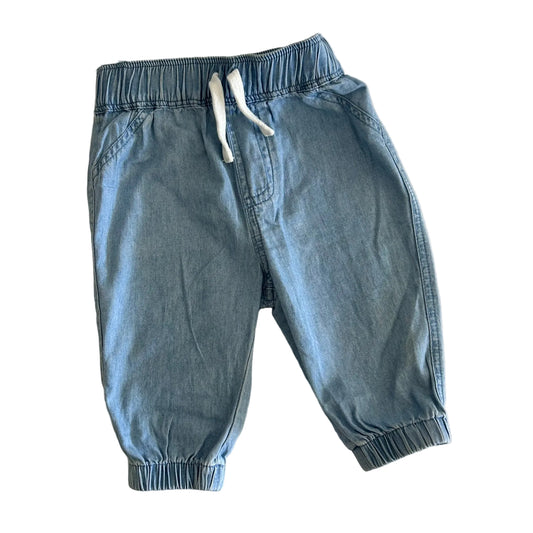 Cotton On Age 000 trousers in light blue with denim wash, elasticated waistband with white drawstring, elasticated cuffs, patch pockets â€” like new condition.
