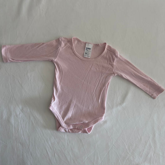 Anko Age 00 long sleeve bodysuit in pink with plain, gently loved condition.