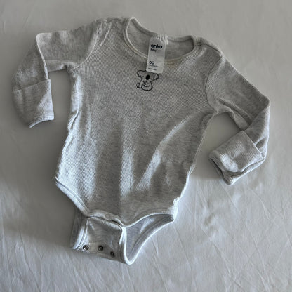 Anko Age 00 long sleeved bodysuit in light grey marl with ribbed stripe, embroidered koala motif on chest, two sets of crotch buttons for different size, fold over sleeves at hands, well loved condition.