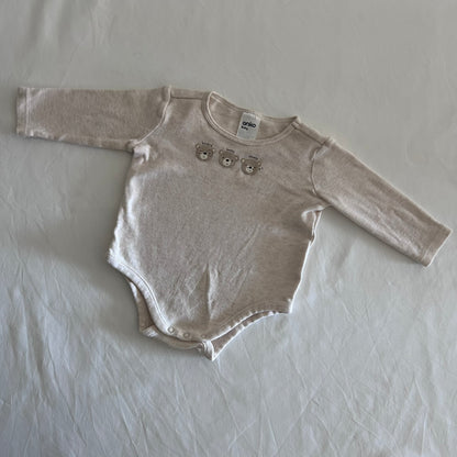 Anko Age 00 long sleeved bodysuit in oatmeal/cream with three printed teddy bear faces labelled hungry, happy, sleepy, gently loved condition.