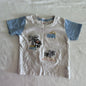 Sprout Age 1 short sleeve t-shirt in white and light blue with embroidered beach scene — monkey climbing palm tree, palm trees, waves, and sun motifs — well loved condition.