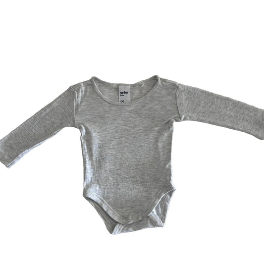 Grey bodysuit on a fabric white background.