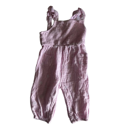 0 sleeveless smocked jumpsuit with snap button and long pants in pink with eyelet embroidery, smocked bodice, ruffle straps, small front pockets — gently loved condition.