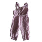 0 sleeveless smocked jumpsuit with snap button and long pants in pink with eyelet embroidery, smocked bodice, ruffle straps, small front pockets — gently loved condition.