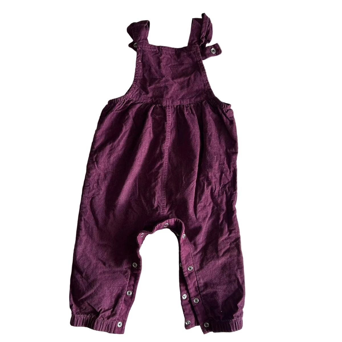 Baby Berry Age 0 corduroy sleeveless dungarees with ruffle straps in plum/burgundy with corduroy ribbed texture, ruffled shoulder straps, gathered waist, snap closures at legs — gently loved condition.