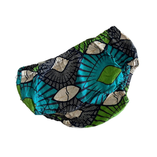 Nenetouti Age 1 nappy cover pants / bloomers in teal, green, black, cream with african wax print with geometric and floral motifs — gently loved condition.