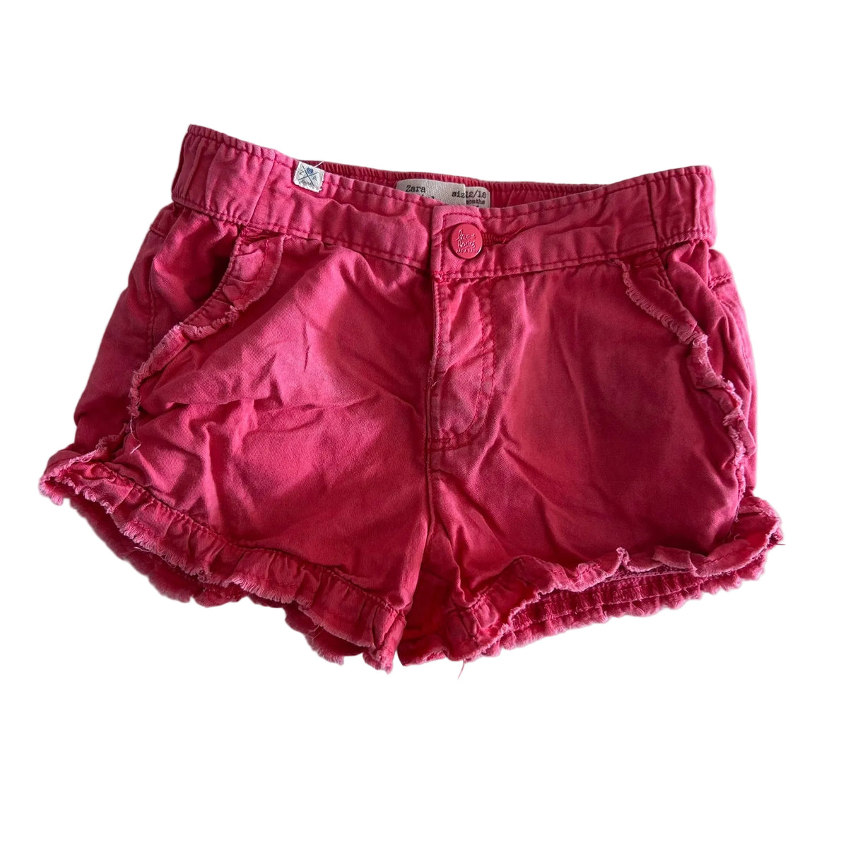 Zara Age 1 shorts in pink with ruffle trim hem and pocket edges — gently loved condition.