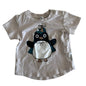 Huxbaby Age 00 short sleeved t-shirt in cream/off-white with penguin graphic print on front — gently loved condition.