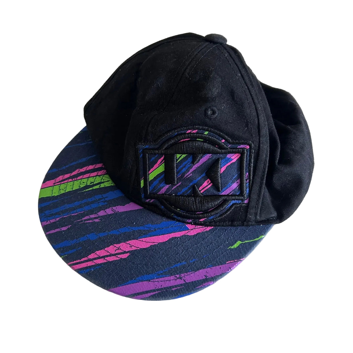 Loose Kid Size 0 cap in black, navy, pink, purple, blue, green with multicolour abstract streak print on brim, embroidered lki logo patch on front — gently loved condition.