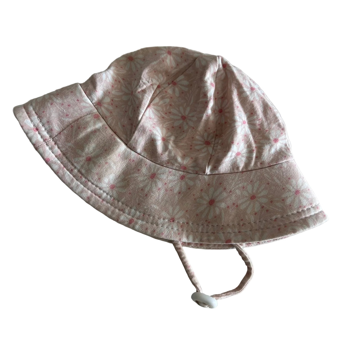 Unknown Age 0 bucket sun hat with chin strap in pink and white with floral daisy print with pink dots — gently loved condition.