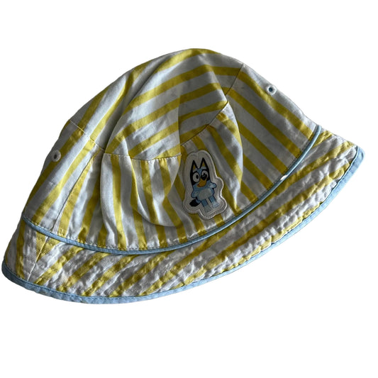 Bluey Age 0 bucket hat in yellow, white, light blue with yellow and white stripes, bluey character patch appliqué — gently loved condition.