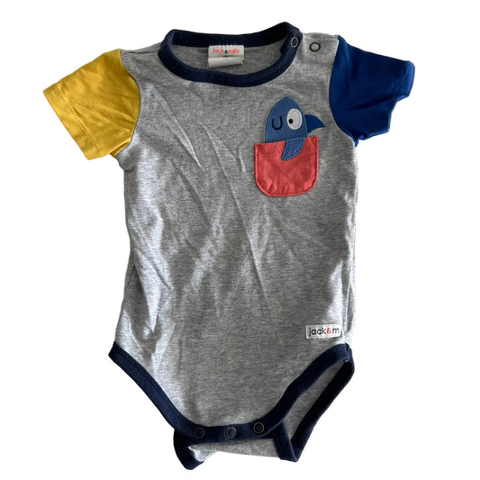 Jack & Milly Age 00 short sleeve bodysuit in grey, navy, yellow, royal blue, coral/orange with colour block sleeves, appliqué parrot peeking out of chest pocket — gently loved condition.