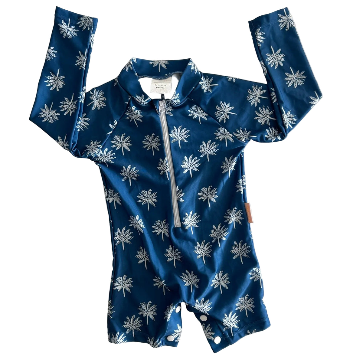 Bare and Boho Age 0 long sleeve zip-up rashguard swimsuit in navy blue and white with all-over white palm tree print — like new condition.