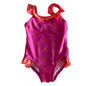 Mango Surf Age 0 one piece swimsuit in hot pink, coral/orange with all-over palm tree print, ruffle trim at shoulders and leg openings — gently loved condition.