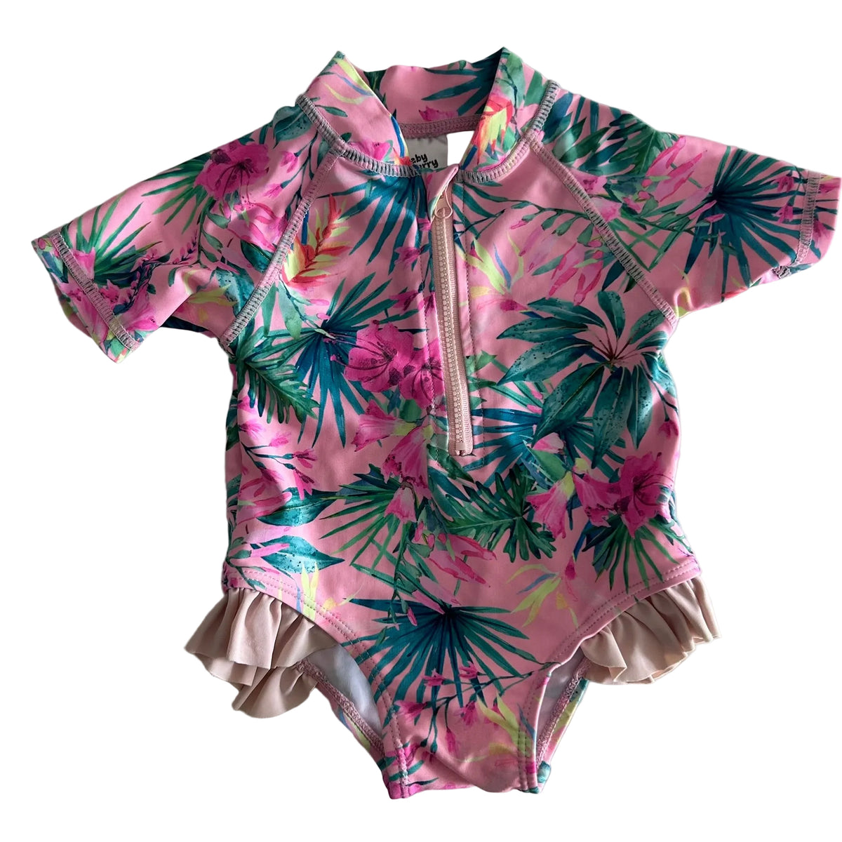 Baby Berry Age 00 short sleeve zip-up one-piece swimsuit with frill trim in pink, green, teal, magenta, yellow with tropical floral and palm leaf print, ruffle/frill detail at bottom hem — gently loved condition.