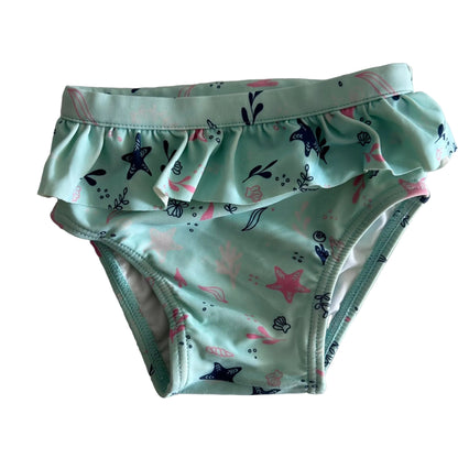 Target Age 0 swim nappy in mint green, navy, pink with ocean/sea life print (starfish, shells, seaweed) with front frill detail — gently loved condition.