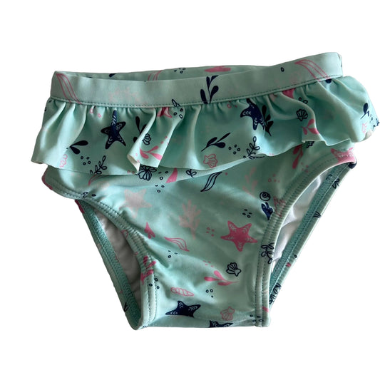 Target Age 0 swim nappy in mint green, navy, pink with ocean/sea life print (starfish, shells, seaweed) with front frill detail — gently loved condition.