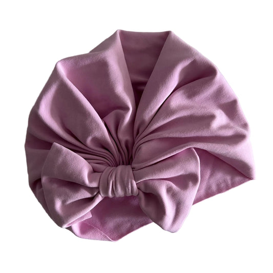 Age 00 turban hat in pink with bow detail — like new condition.