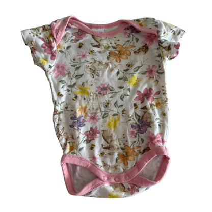 Baby Berry Age 0 short sleeve bodysuit in white, pink with floral and bumblebee print with pink trim — gently loved condition.