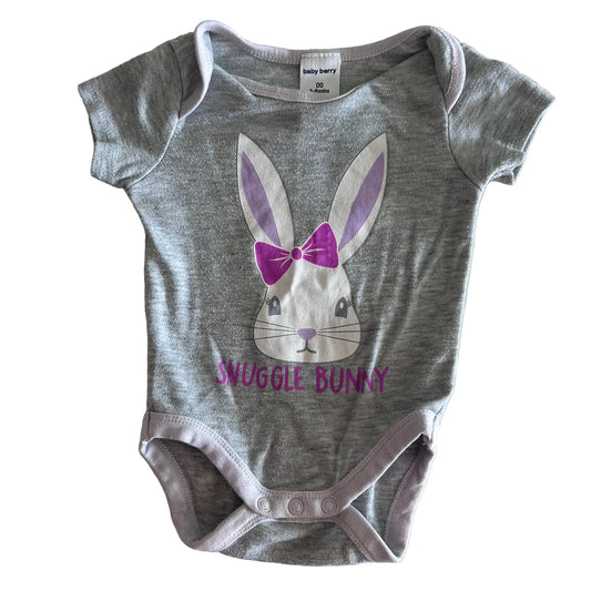 Baby Berry Age 00 short sleeve bodysuit in grey, lilac, white, purple with bunny face graphic with bow and 'snuggle bunny' text print — gently loved condition.