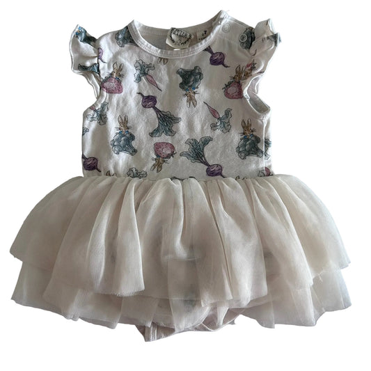 Peter Rabbit Age 0 short sleeved bodysuit tutu dress in white, cream with peter rabbit characters (rabbits, beets, carrots, strawberries, leafy vegetables) allover print with layered cream tulle skirt and flutter sleeves — gently loved condition.