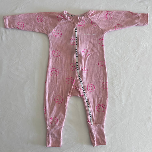 Bonds Age 00 onesie / zippy wondercool in pink with hot pink smiley face print allover â€” like new condition.