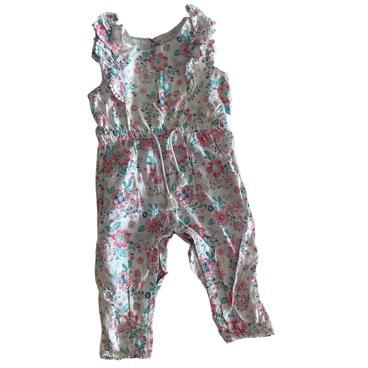Purebaby Age 1 sleeveless jumpsuit in white, pink, teal, navy with floral print with ruffled trim and pom-pom lace edging — gently loved condition.