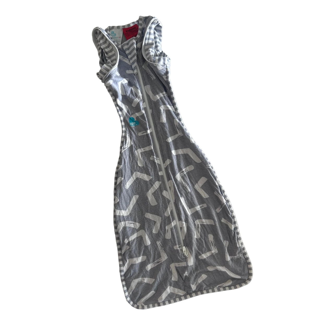 Love To Dream Age 00 swaddle sleep bag / sleep sack in grey and white with abstract brushstroke chevron print with grey and white stripe trim and stripe back pocket — gently loved condition.